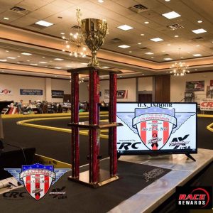 A four post trophy with gold cup.