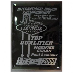A black mirror glass plaque by Race Rewards